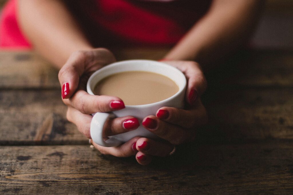 Someone holding a warm cup of tea
