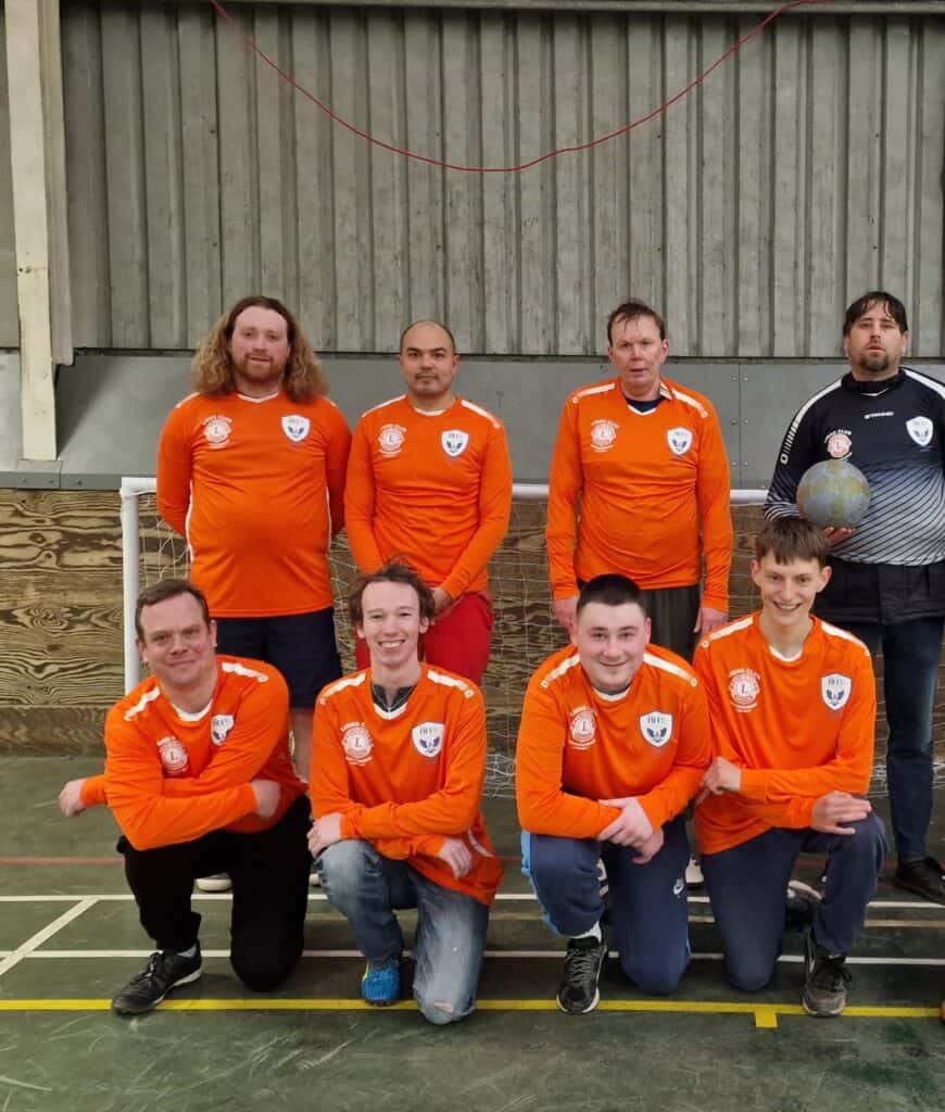 Surrey Eagles football team pausing before a match